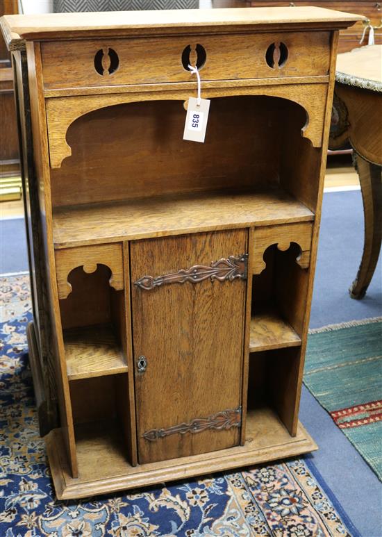 An Arts and Crafts oak bookcase W.57cm